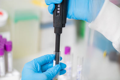 Using a micropipette in a biolab