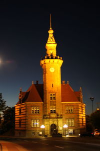 Low angle view of illuminated building against sky at night