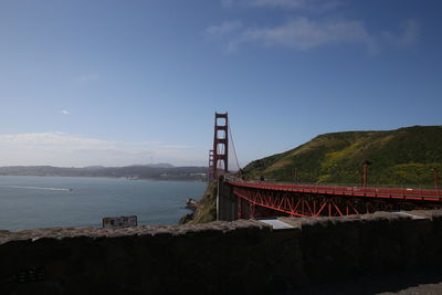 Golden gate bridge over sea against sky
