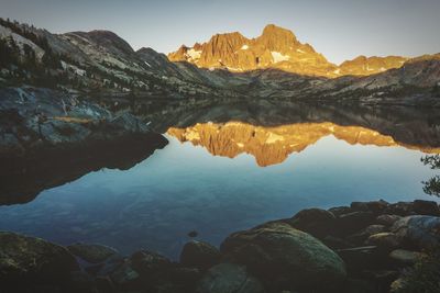 Scenic view of lake and mountains against sky