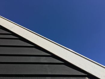 Low angle view of built structure against blue sky