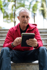 Man sitting on mobile phone