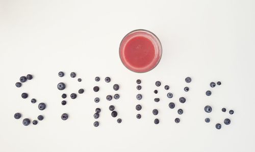 Close-up of red object over white background