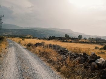 Road by land against sky