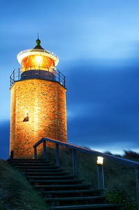 Low angle view of illuminated building against sky