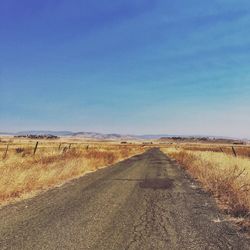 Road passing through field