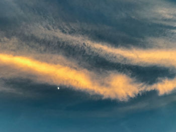 Low angle view of clouds in sky during sunset