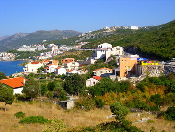 Buildings in town against sky