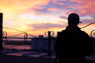 Silhouette of man against cloudy sky