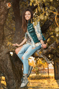 Young woman sitting on rock