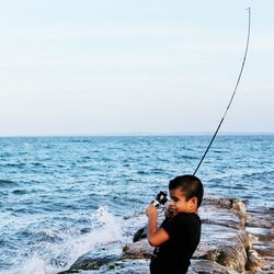 Man fishing in sea