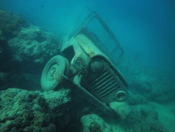 Sunken car on the bottom of the sea