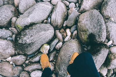 Low section of woman on rocks