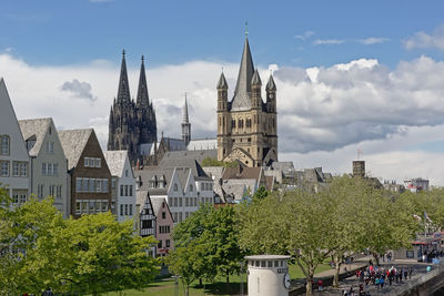 Panoramic view of buildings in city against sky