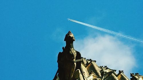 Low angle view of building against blue sky