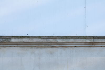 Close-up of wall against sky