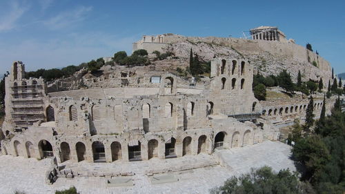 Abandoned amphitheater against blue sky