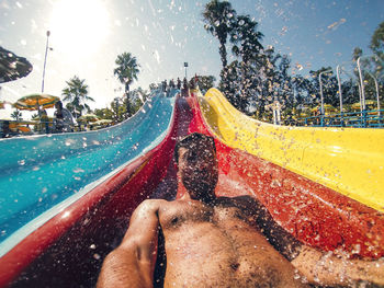 Low angle view of man in slide