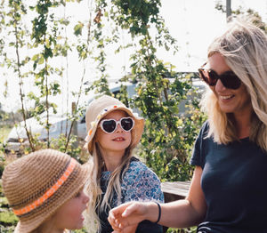 Portrait of smiling woman wearing sunglasses