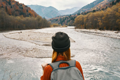 Rear view of man looking at mountains