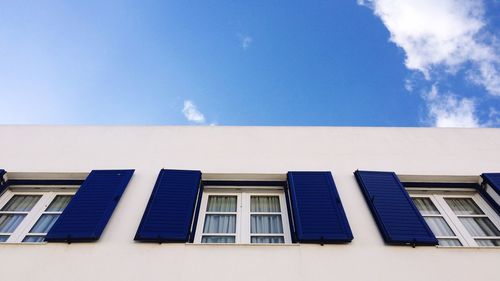 Low angle view of building against blue sky