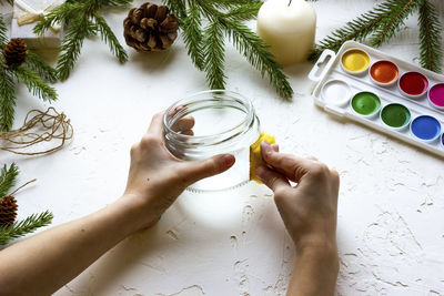 High angle view of woman hand holding food