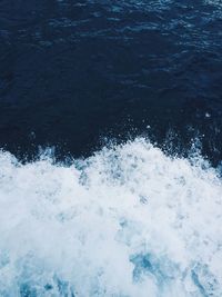 High angle view of waves splashing in sea