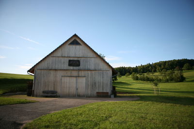 Built structure on field against clear sky