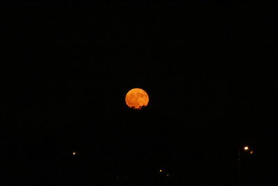 Low angle view of moon against sky at night