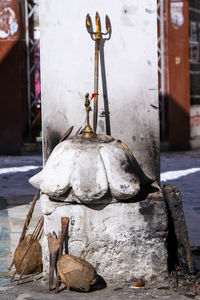 Close-up of fire hydrant on table against building