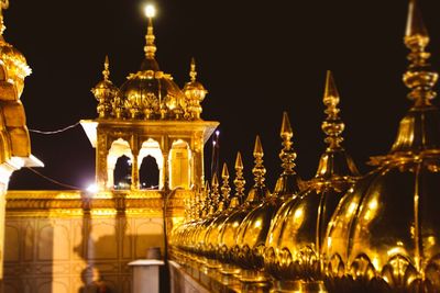 Low angle view of illuminated building at night