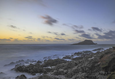 Scenic view of sea against sky during sunset