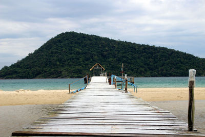 Pier over sea against sky