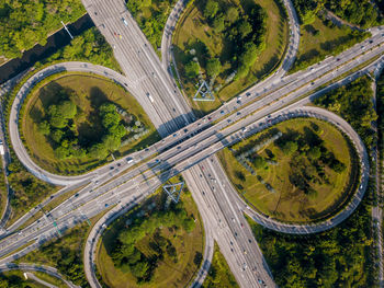 High angle view of highway amidst trees in city