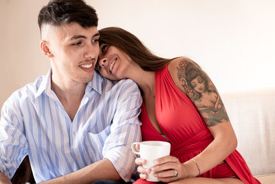 Young couple sitting outdoors