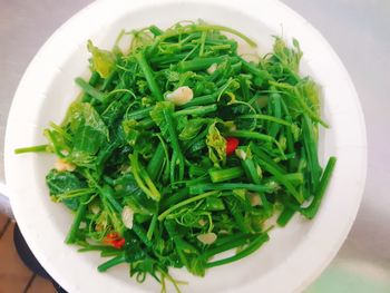 High angle view of chopped vegetables in bowl on table