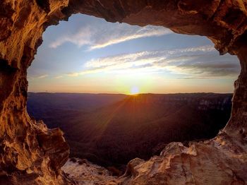 Scenic view of rock formation against sky during sunset