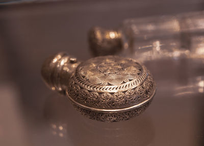 Close-up of metal container on table