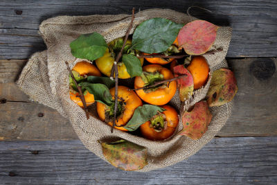 High angle view of fruits in basket on table