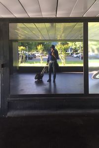 Woman standing on railroad platform