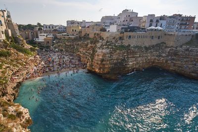 High angle view of townscape by sea