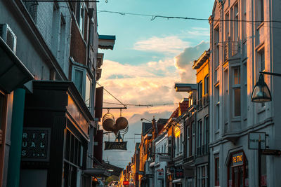 Low angle view of buildings against sky during sunset