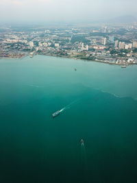 High angle view of cityscape by sea