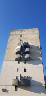 Low angle view of building against blue sky