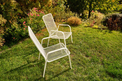 Empty chair on table in garden