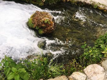 High angle view of rocks by river