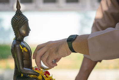 Low angle view of statue against temple