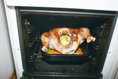 High angle view of meat on barbecue grill