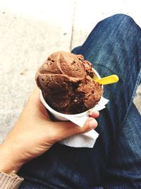 Midsection of person holding ice cream