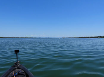 Scenic view of sea against clear blue sky